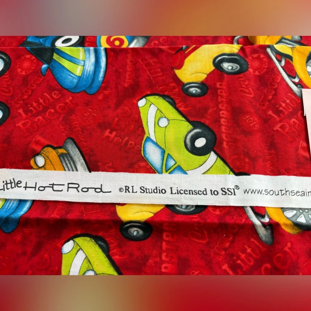 SSI Little Hot Rods fabric. Multicolor race cars on red background. 1 yard cut.